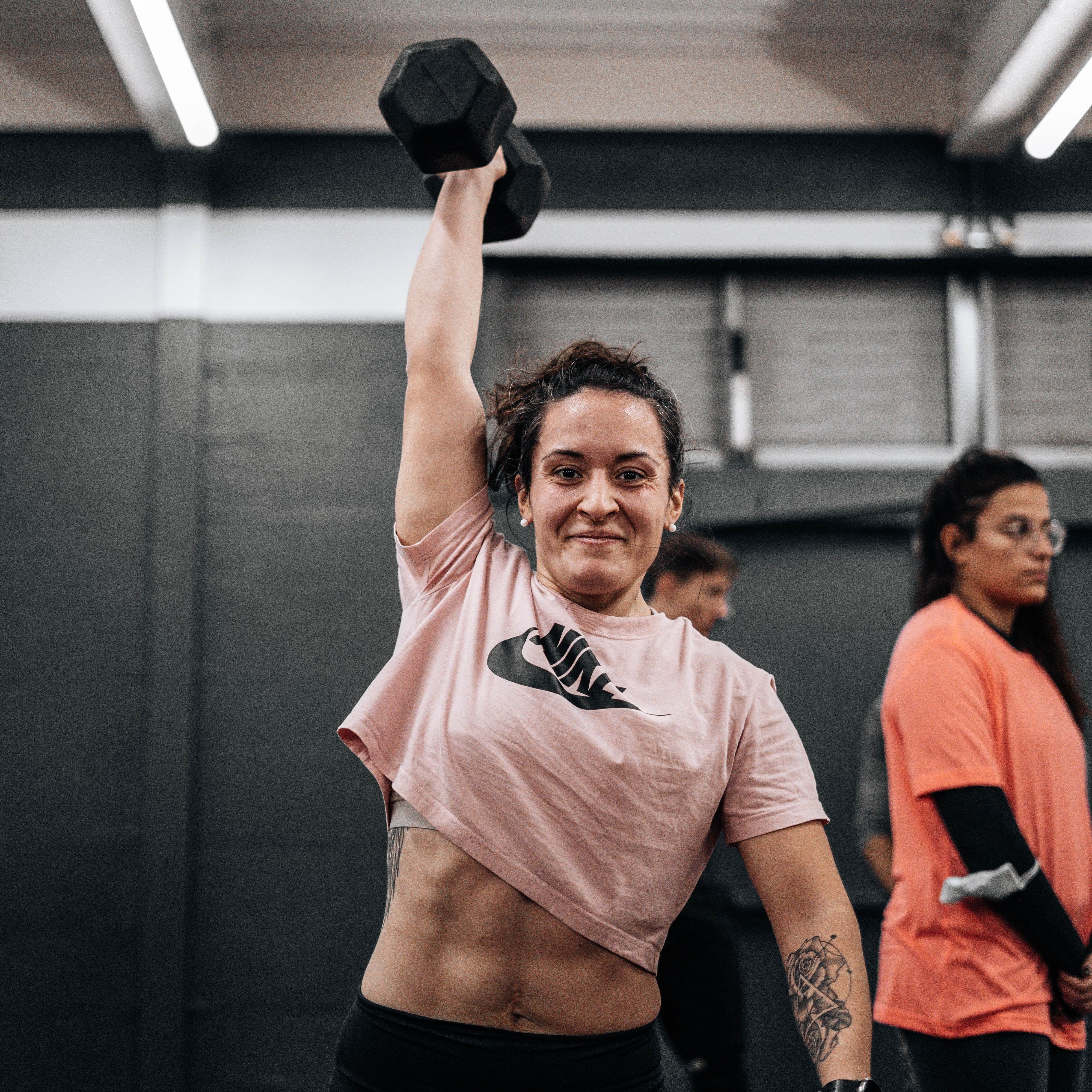 Women holding up a dumbbell